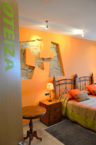 a bedroom with two beds and a cross on the wall at Iturritxo Landetxea in Donostia-San Sebastián