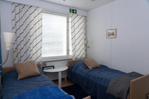 Postel nebo postele na pokoji v ubytování Wilderness Estate Pukari, Kuusamon Erämajoitus