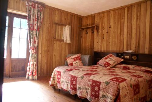 Cama o camas de una habitación en Albergo Boule de Neige