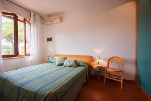Residence Le Grazie Estにあるベッド