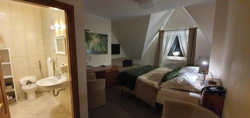 Koupelna v ubytování KARCZMA MYŚLIWSKA