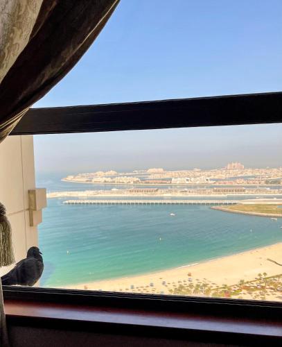 a window view of a beach and the ocean at JBR Jumeirah beach SADAF6 sea view in Dubai