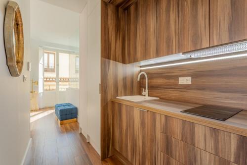a kitchen with a sink and a counter top at Bib Rambla Luxury Apartments in Granada