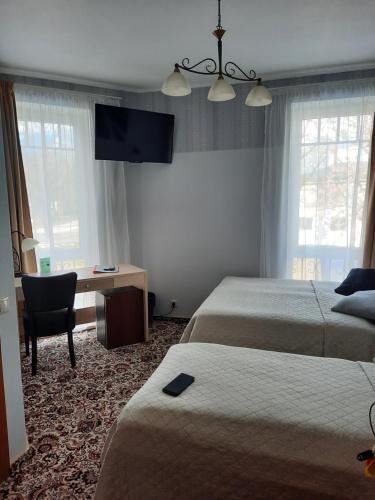 Ein Bett oder Betten in einem Zimmer der Unterkunft Hotel Pils with Self-Check in