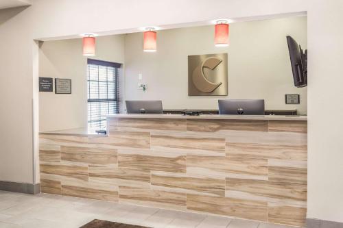 an office lobby with two laptops on the counter at Comfort Inn & Suites Fairburn - Atlanta Southwest in Fairburn