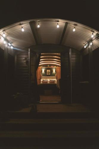 a dark room with a bus with lights at Westfield House Farm in Rothbury