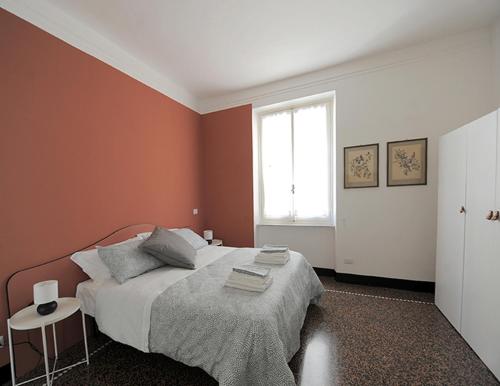 A bed or beds in a room at La Casa della Fiore