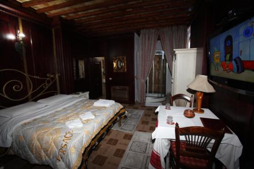 Postel nebo postele na pokoji v ubytování Hotel Iliada
