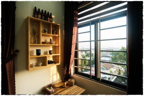 a room with a window with a view of a city at Nhà của Elly in Da Nang