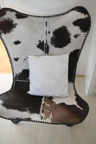 a black and white chair with a white pillow at Haus Sonnenblick in Lam