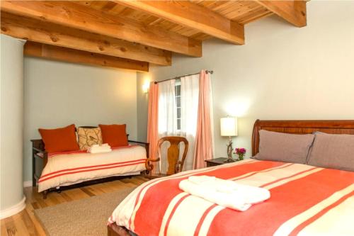 a bedroom with two beds and a window at Blue Cherry! Redwoods! BBQ Grill! Fire Table! Ping Pong! Fast WiFi!! Dog Friendly! in Guerneville
