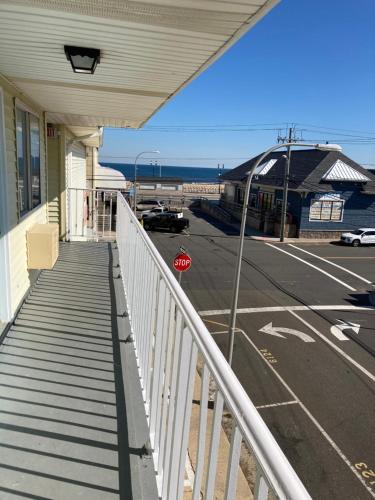 a stop sign on a balcony of a building at Surfside Motel - Seaside Heights in Seaside Heights