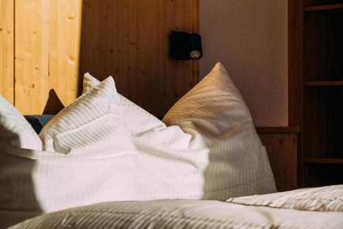 a pile of pillows sitting on top of a bed at Alp Apart in Oetz