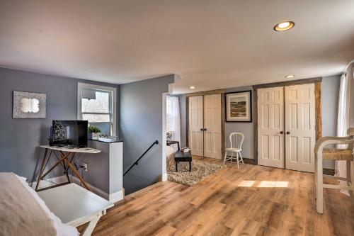 a bedroom with a bed and a desk with a computer at Secluded Lothian Farmhouse on 45 Acres with Fire Pit in Lothian