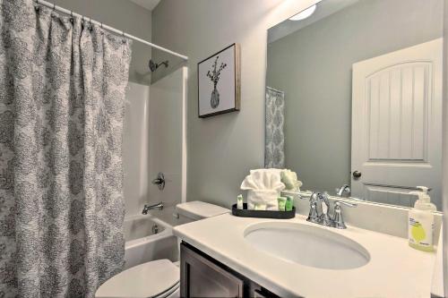 a bathroom with a sink and a toilet and a shower at Family Home with Views about 5 Mi to Downtown Asheville! in Asheville
