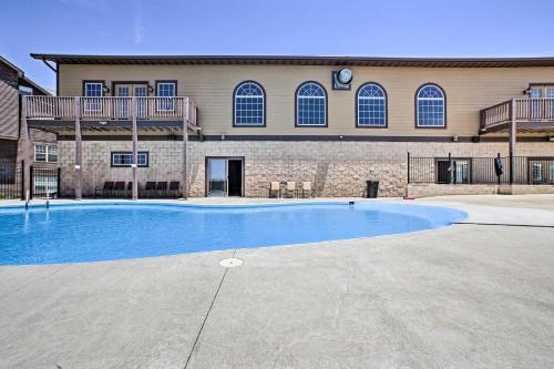 a large swimming pool in front of a building at Luxe Mtn-View Condo in Branson with Hot Tub Access! in Branson