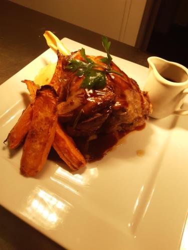 a plate of food with meat and fries on a table at Best Western Red Lion Hotel in Salisbury
