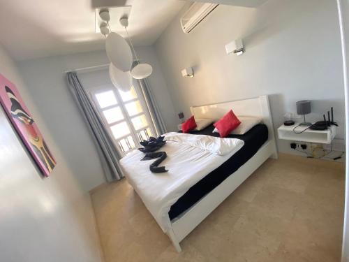 A bed or beds in a room at El Gouna Abu Tig Marina OV3550