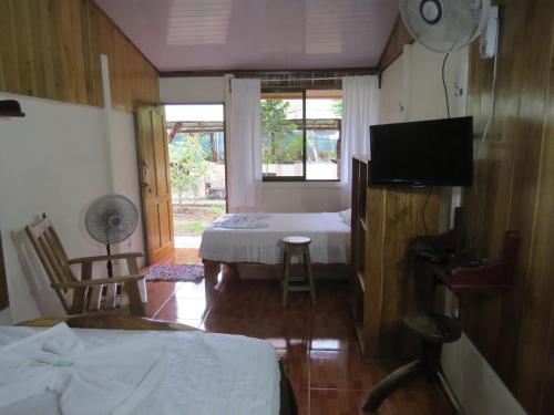 Ένα ή περισσότερα κρεβάτια σε δωμάτιο στο Poponjoche Lodge Caño Negro
