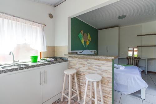 Кухня или мини-кухня в Pousada Marina da Praia
