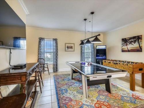a living room with a ping pong table at Ocean View Luxury Rental - Sleeps 16 in Myrtle Beach