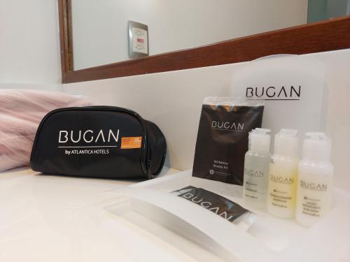 a counter with a bag and some products on it at Bugan Recife Boa Viagem Hotel - by Atlantica in Recife