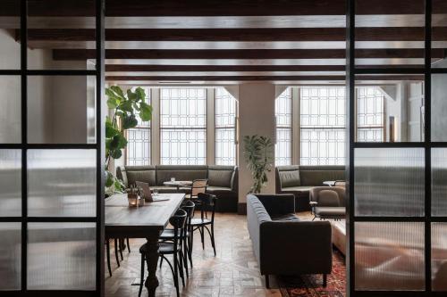 a living room filled with furniture and a window at ROOST Rittenhouse in Philadelphia
