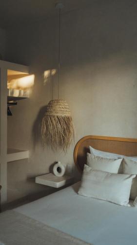 Ένα ή περισσότερα κρεβάτια σε δωμάτιο στο Casa Peregrino Holbox