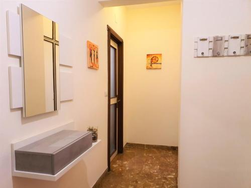 a bathroom with a sink and a mirror at Centre Home in Rapallo