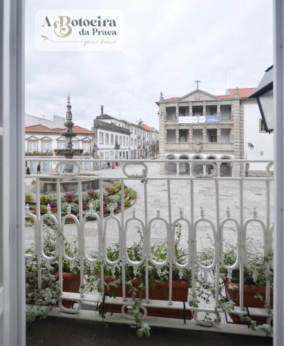 a view of a city from a balcony at A Botoeira da Praça guest house in Viana do Castelo