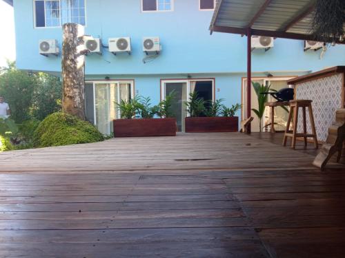 a wooden deck in front of a building at La Luciernaga Big Creek in Bocas del Toro