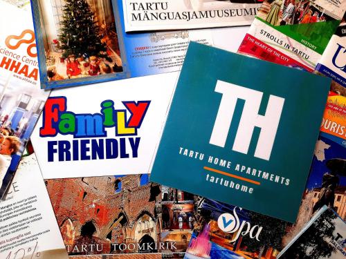 a pile of magazines with the words family friendly at City Center Turu str apartments, parking, Tartu Home in Tartu