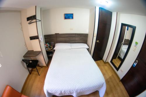 Un ou plusieurs lits dans un hébergement de l'établissement Hotel Plaza Muisca