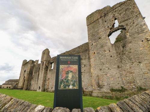 a sign in front of a castle at Demonicus in Leyburn