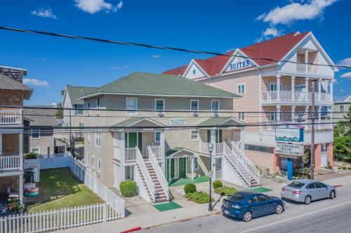 a row of houses on a street with cars parked in front at Boardwalk Terrace in Ocean City