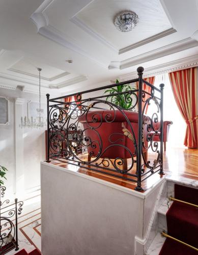 a staircase with a red bench in a room at Hotel Best Roma in Rome
