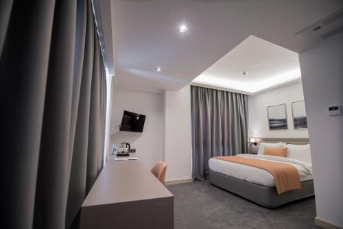 A bed or beds in a room at Dovv Hotel Busıness