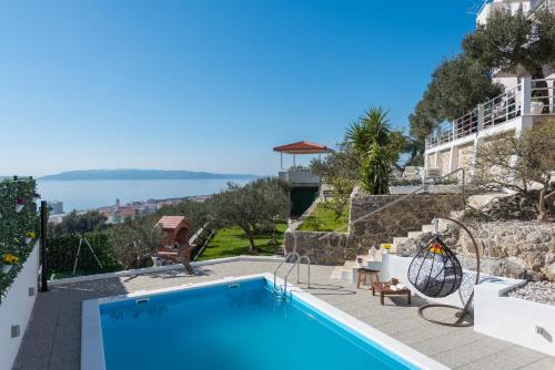 a villa with a swimming pool with a view at Villa Petra Apartment with private pool in Makarska