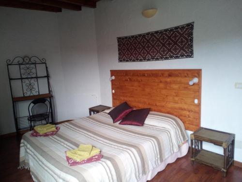 a bedroom with a bed with two towels on it at B&B Baddesalighes in Bolotana