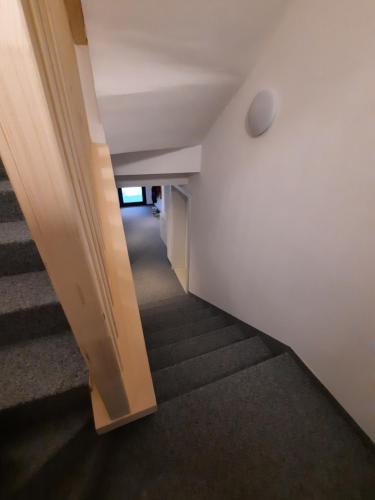 an empty hallway with stairs in a building at Haus Fien in Heiligenblut