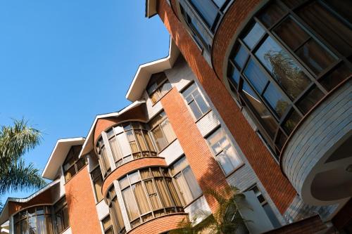 a brick building with windows on the side of it at Kibo Palace Hotel Arusha in Arusha