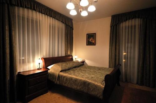 Una cama o camas en una habitación de Hotel Salamandra