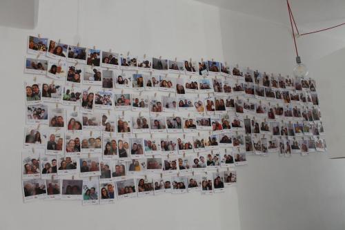a collage of photos of people on a wall at Interno5 Apartment in La Spezia