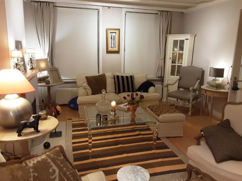 a living room with a couch and a table at Villa commune PoldersView in Sluis