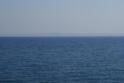 a large body of blue water with a horizon at Yria Hotel in Zakynthos Town