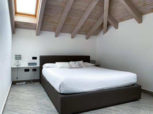 a bedroom with a bed and a dresser at La Corte del Gallo in Gallarate