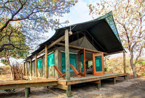 a house with a roof on a table at Fathala Wildlife Reserve in Toubakouta