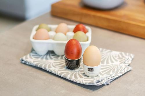 a tray with eggs and a bowl of eggs at lovely&cool STIL-HAUS in Fehmarn