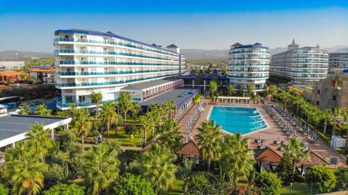 an aerial view of a resort with a pool and buildings at Eftalia Marin Resort in Konaklı