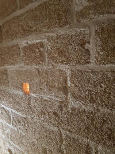 a brick wall with a piece of paper on it at Corte Moline in Gallipoli